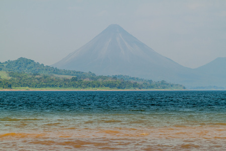 Laguna de Arenal reservoir, Costa Rica. Arenal volcano in the background.の写真素材