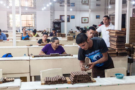ESTELI, NICARAGUA - APRIL 21, 2016: Workers rolling cigars at Tabacalera Santiago cigar factory in Esteli.のeditorial素材