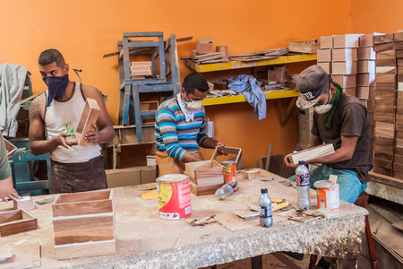 ESTELI, NICARAGUA - APRIL 21, 2016: Workers manufacturing wooden boxes for cigars in Tabacalera Santiago cigar factory in Esteli.のeditorial素材