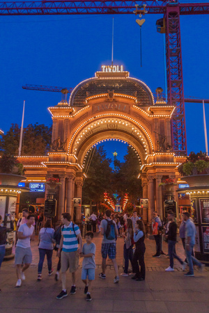 COPENHAGEN, DENMARK - AUGUST 27, 2016: Evening view of an entrance to Tivoli Gardens, a famous amusement park and pleasure garden in Copenhagen, Denmarkのeditorial素材
