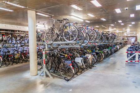 EINDHOVEN, NETHERLANDS - AUGUST 29, 2016: Underground bicycle parking at 18 Septemberplein square in Eindhoven.のeditorial素材