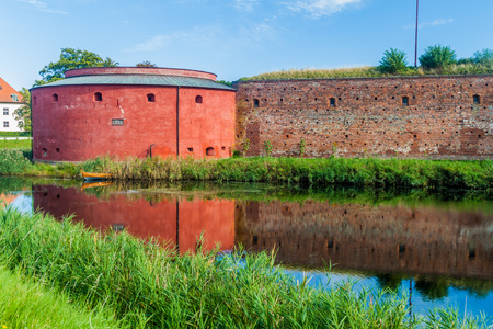 Fortification walls of Malmo Castle reflecting in its moat, Swedenのeditorial素材