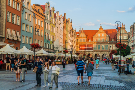 GDANSK, POLAND -  SEPTEMBER 1, 2016: Evening view of people walk along historic houses at Dlugi Targ square in Gdansk, Poland.のeditorial素材