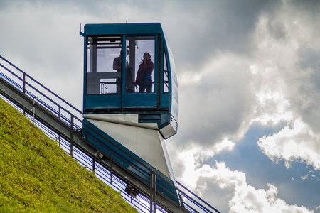 VILNIUS, LITHUANIA - AUGUST 15, 2016: People ride in the Funicular to Gediminas Hill in Vilnius,...