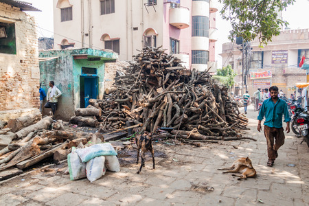 VARANASI, INDIA - OCTOBER 25, 2016: Piles of fire wood used for ghat cremations in Varanasi, India