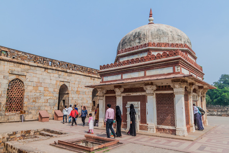 DELHI, INDIA - OCTOBER 23, 2016: Tourists visit Tomb of Imam Zamin in Qutub complex in Delhi, India.のeditorial素材