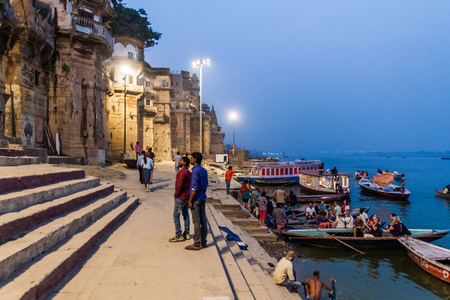 VARANASI, INDIA - OCTOBER 25, 2016: Evening view of a Ghat (riverfront steps) of sacred river Ganges in Varanasi, Indiaのeditorial素材