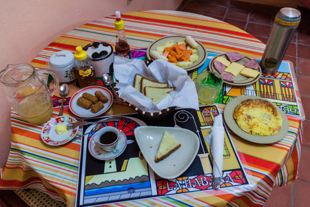 CIENFUEGOS, CUBA - FEBRUARY 11, 2016: Breakfast in a rental room for tourists (casa particular) in Cienfuegos, Cuba.のeditorial素材