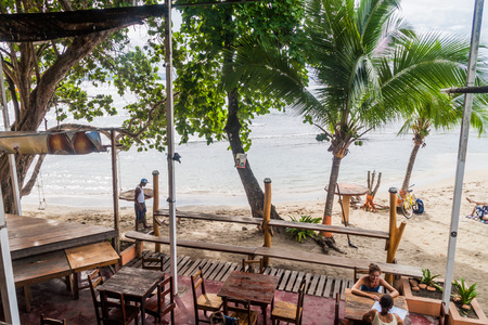 PUERTO VIEJO DE TALAMANCA, COSTA RICA  - MAY 16: Tourists at a beach bar near Lazy Loft Beach Hostel in Puerto Viejo village.のeditorial素材