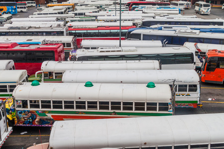 PANAMA CITY, PANAMA - MAY 30, 2016: Buses wait at Albrook Bus Terminal in Panama City.のeditorial素材