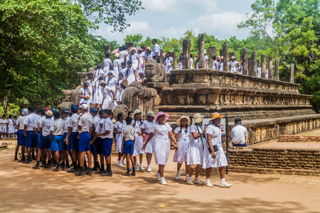POLONNARUWA, SRI LANKA - JULY 22, 2016: Children in school uniforms visit Audience hall at the ancient city Polonnaruwa, Sri Lankaのeditorial素材