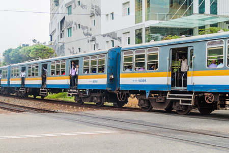 COLOMBO, SRI LANKA - JULY 26, 2016: Suburban train rides through Colombo, Sri Lanka