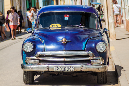 TRINIDAD, CUBA - FEB 8, 2016: Vintage Oldsmobile car on a street in the center of Trinidad, Cuba.のeditorial素材