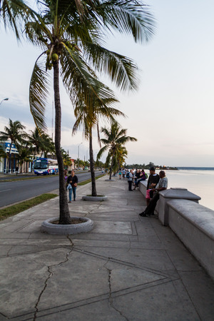 CIENFUEGOS, CUBA - FEBRUARY 10, 2016: Evening view of Malecon (seaside drive) in Cienfuegos, Cuba.のeditorial素材