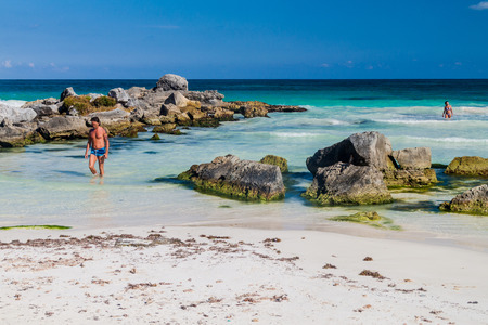 TULUM, MEXIO - FEB 29, 2016: Tourists enjoy the Caribbean beach in Tulum, Mexicoのeditorial素材