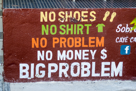 CAYE CAULKER, BELIZE - MARCH 2, 2016: Slogan of the island painted on a wall in Caye Caulker village, Belizeのeditorial素材