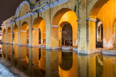 ANTIGUA, GUATEMALA - MARCH 26, 2016: Arches (public laundry tank)  on  Tanque la Union square in Antigua Guatemala town, Guatemala.のeditorial素材