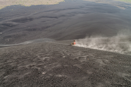 CERRO NEGRO, NICARAGUA - APRIL 26, 2016: Tourist is volcano boarding from Cerro Negro volcano, Nicaraguaのeditorial素材