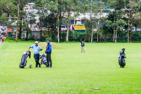 NUWARA ELIYA, SRI LANKA - JULY 17, 2016: Golf players at Victoria Golf Club in Nuwara Eliya town.