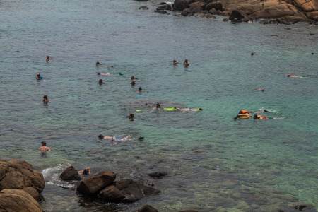 PIGEON ISLAND, SRI LANKA - JULY 25, 2016: People snorkel on a coral reef in Pigeon Island National Park near Nilaveli village in Sri Lanka.のeditorial素材