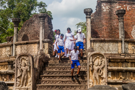 POLONNARUWA, SRI LANKA - JULY 22, 2016: Children in school uniforms visit Vatadage in the ancient city Polonnaruwa, Sri Lankaのeditorial素材