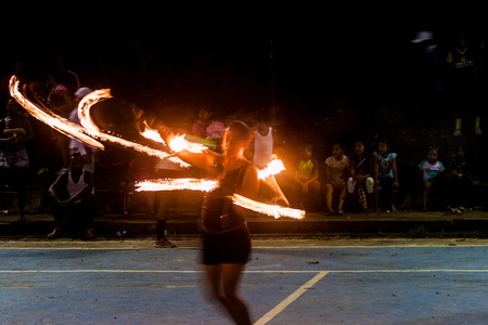 PORTOBELO, PANAMA  - MAY 28, 2016: Woman performs a fire show in Portobelo, Panamaのeditorial素材