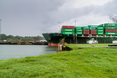 GATUN, PANAMA - MAY 29, 2016: Container ship is passing through Gatun Locks, part of Panama Canalのeditorial素材