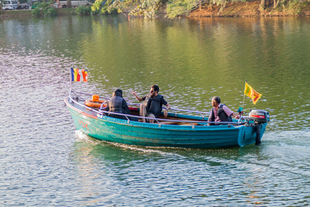 KANDY, SRI LANKA - JULY 19, 2016: Tourists at a boat at Bogambara lake in Kandy, Sri Lanka