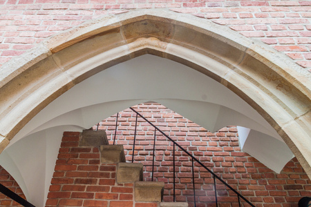 Gothic arch at Collegium Maius (Great College) courtyard of the Jagellonian University in Krakow.の写真素材