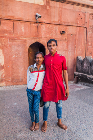 DELHI, INDIA - OCTOBER 22, 2016: Two local men at a courtyard of Jama Masjid mosque in the center of Delhi, India.のeditorial素材