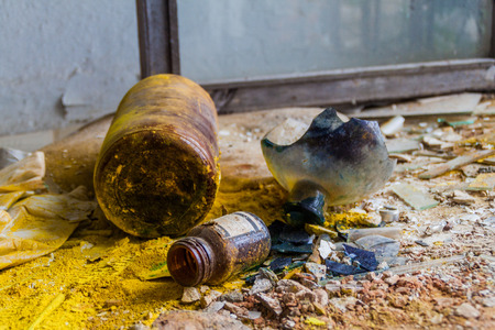 Broken glasses of chemicals in an old abandoned hospital