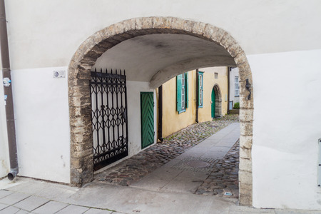 Arch over a narrow street in Tallinn, Estonia