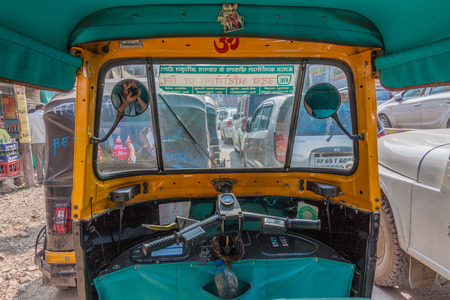 VARANASI, INDIA - OCTOBER 25, 2016: View from a auto rickshaw on a street in Varanasi, India