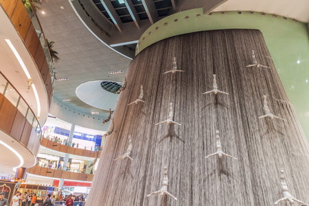 DUBAI, UAE - MARCH 10, 2017: Human waterfall in the Dubai Mall, one of the largest malls in the world.のeditorial素材