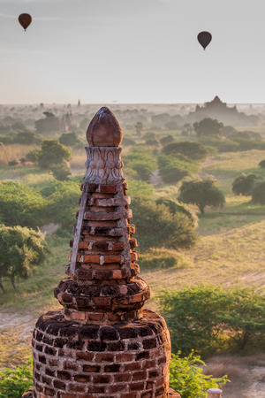 Detail of Ta Wet Hpaya temple in Bagan, Myanmar. Balloons over Bagan visible.の写真素材
