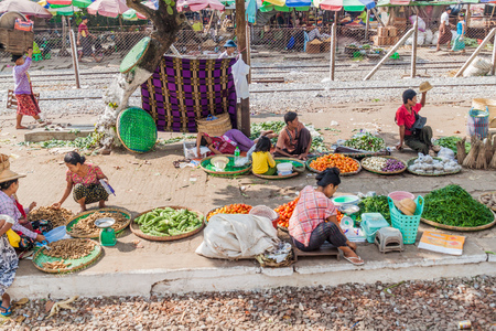 YANGON, MYANMAR - DECEMBER 16, 2016: Railway station platform used as a market place in Yangon.のeditorial素材