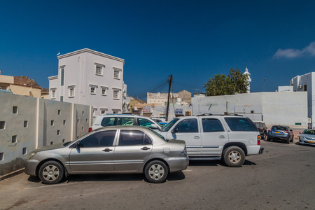 MUSCAT, OMAN - FEBRUARY 23, 2017: Parking lot in Muttrah neighborhood in Muscat, Omanの写真素材