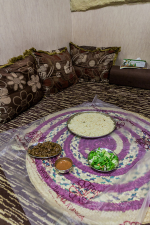 MUSCAT, OMAN - FEBRUARY 21, 2017: Traditional food eaten on ground in a restaurant in Muscat, Omanのeditorial素材