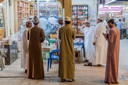 SALALAH, OMAN - FEBRUARY 24, 2017: Local men at a frankincense stall at Al Husn Souq in Salalah, Omanのeditorial素材