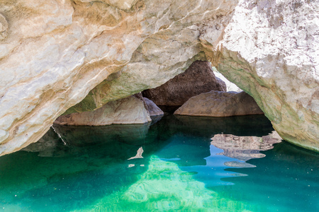 Turquoise water of a creek in Wadi Tiwi valley, Omanの写真素材