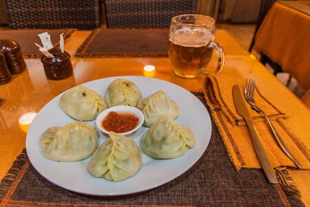 Manty dumplings and a beer in a restaurant in Bishkek, Kyrgyzstanの写真素材