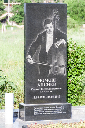 BISHKEK, KYRGYZSTAN - MAY 28, 2017: Tombstone at Ala Archa cemetery in Bishkek, capital of Kyrgyzstan.のeditorial素材