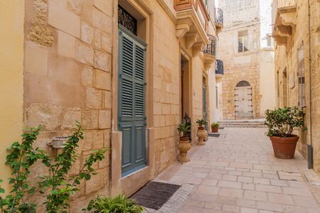Typical narrow street in Birgu town, Maltaの写真素材