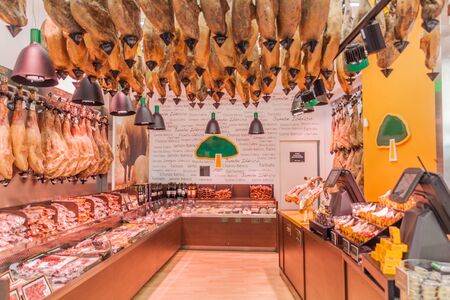 TOLEDO, SPAIN - OCTOBER 23, 2017: Interior of a meat shop full of hams in Toledo, Spainの写真素材
