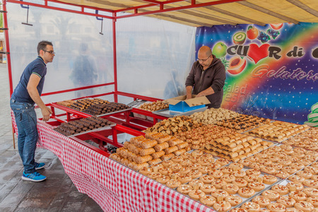 MARSAXLOKK, MALTA - NOVEMBER 12, 2017: Pastry stall at the Marsaxlokk Open Market.のeditorial素材
