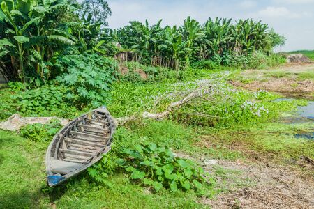 Small boat on a char (sandbank island) in Jamuna river, Bangladesh.の写真素材