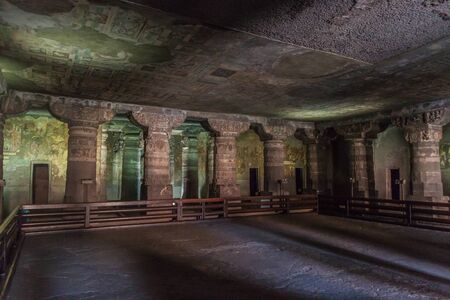 Interior of a Buddhist cave carved into a cliff in Ajanta, Maharasthra state, Indiaの写真素材