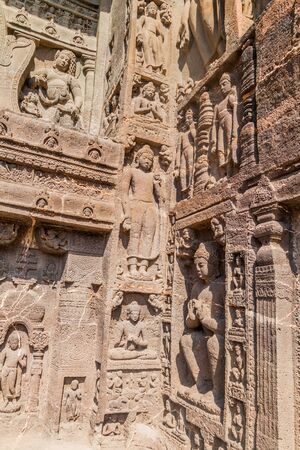 Ornate entrance of the Buddhist chaitya (prayer hall), cave 19, carved into a cliff in Ajanta,...