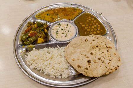 Platter of thali, typical meal in Indiaの写真素材