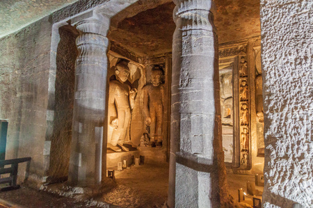 AJANTA, INDIA - FEBRUARY 6, 2017: Interior of a Buddhist cave carved into a cliff in Ajanta,...